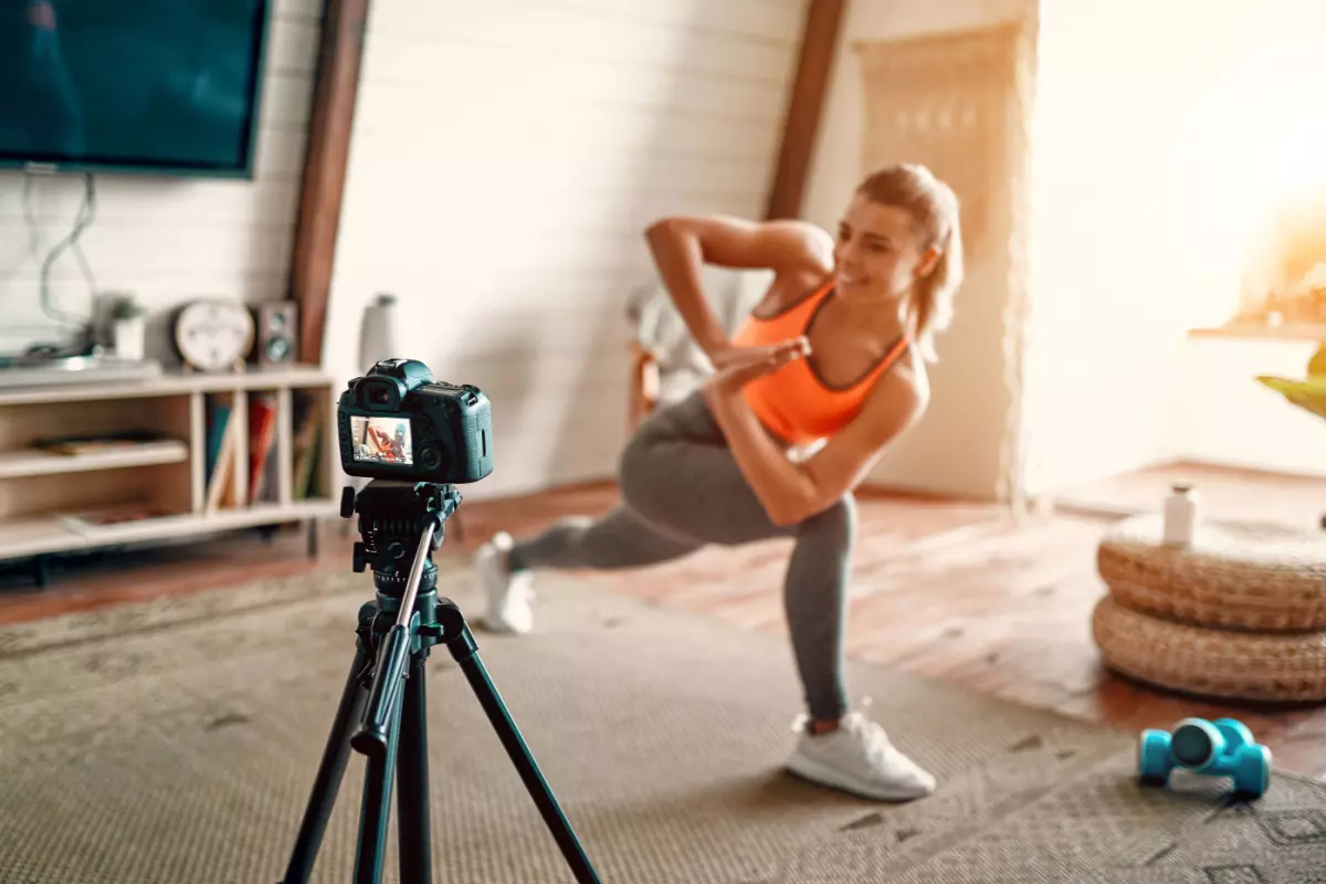 Fitness instructor filming videos