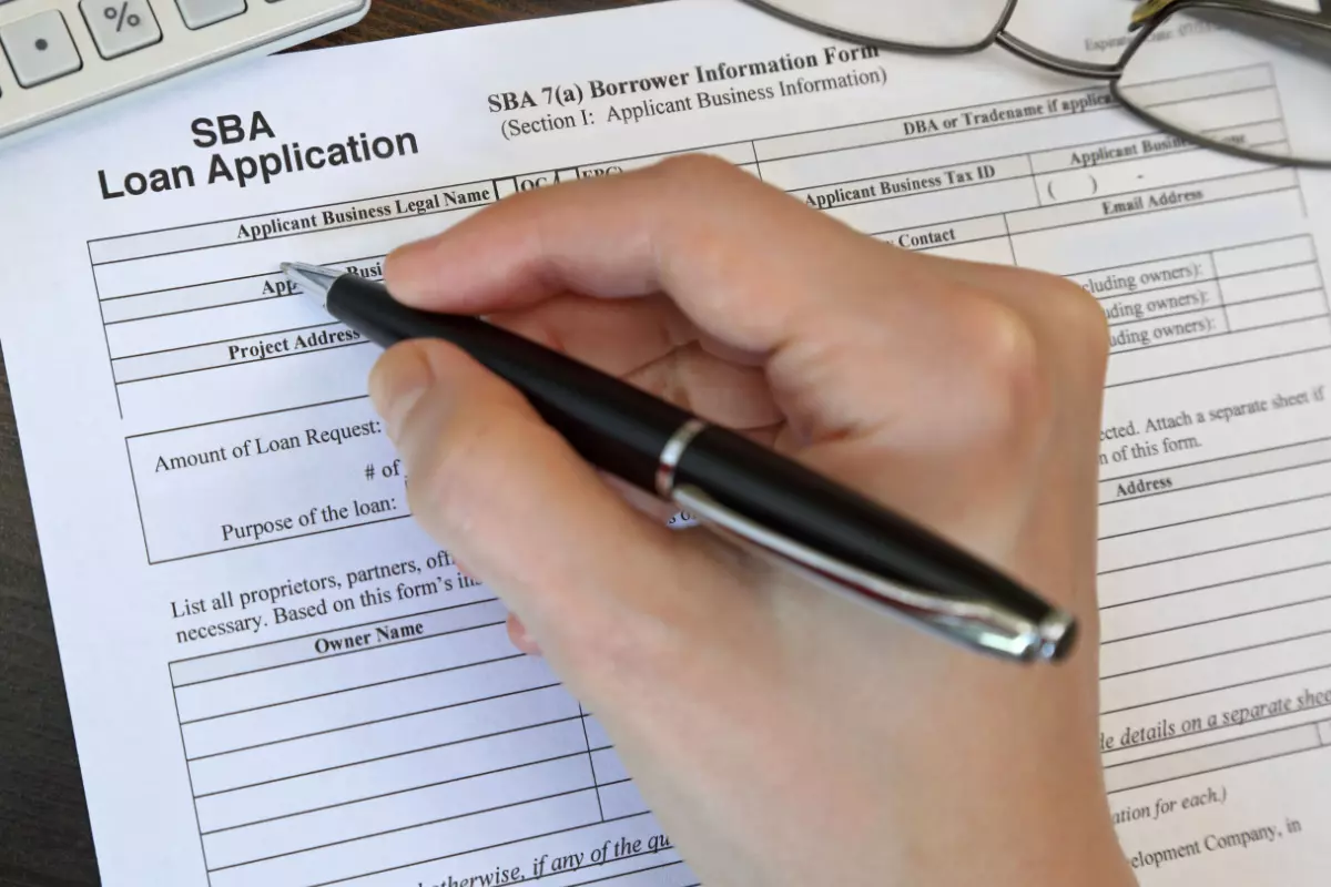 Business owner filling out SBA loan application